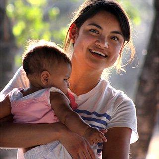 Missionary holding a baby